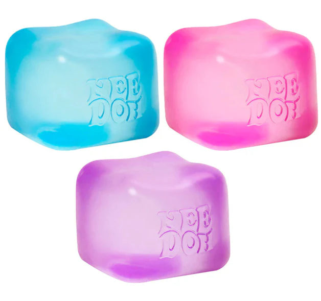 All three NeeDoh Nice Cube colors together — translucent blue, pink and purple Schylling squishy stress toys